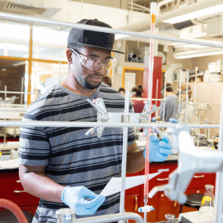 Student researching in lab at RWU